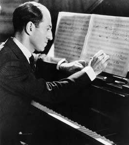 George looks over his sheet music